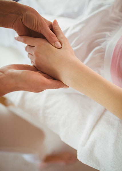 young woman getting a hand massage